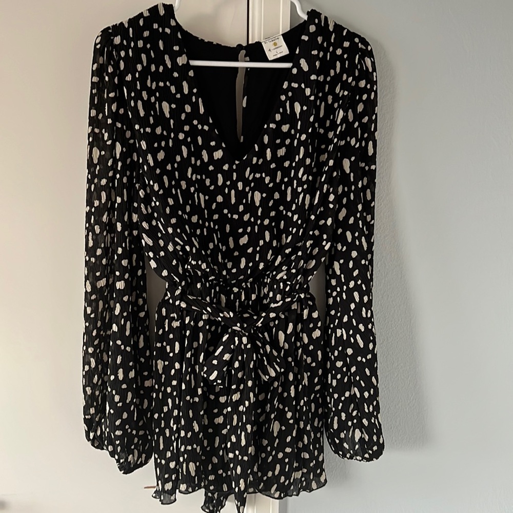 Black romper with a belt
